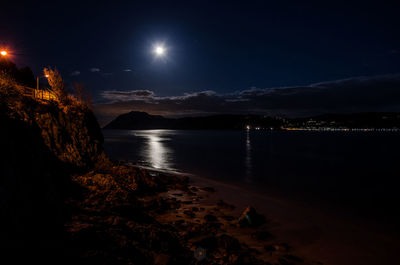 Scenic view of illuminated mountains at night