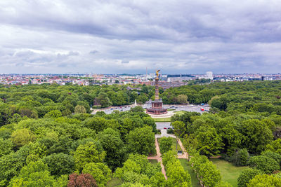 High angle view of trees and buildings against sky