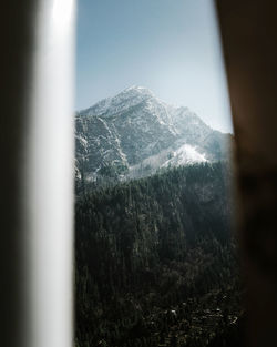 Scenic view of snowcapped mountains against clear sky