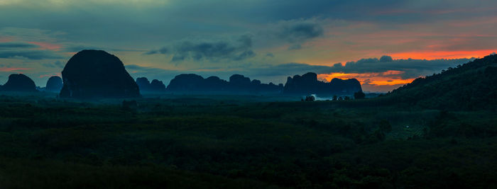 Scenic view of silhouette landscape against sky during sunset