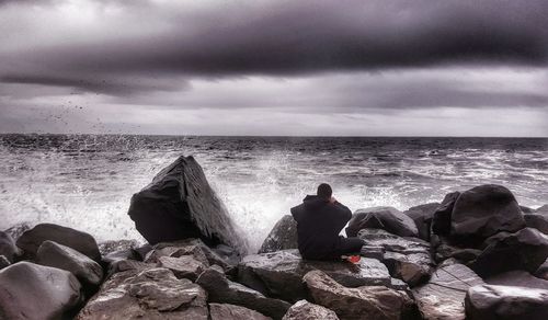 Scenic view of sea against cloudy sky