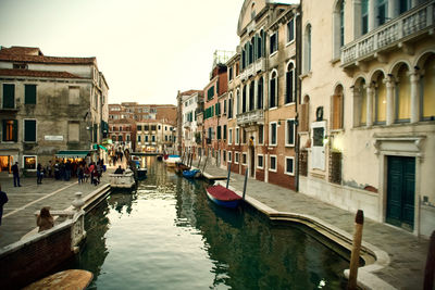 Canal passing through city buildings