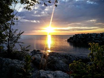 Scenic view of sea at sunset