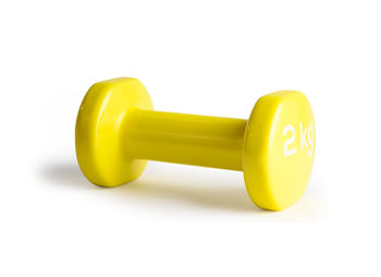 Close-up of yellow toy over white background