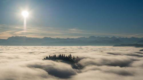 Scenic view of mountains against sky at sunset