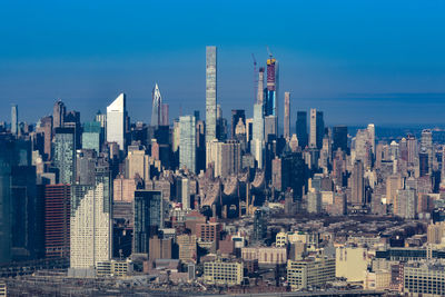 Modern buildings in city against sky