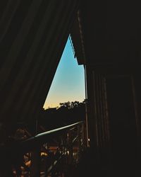 Low angle view of silhouette building against sky