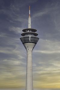 Low angle view of lighthouse against sky during sunset. düsseldorf rheinturm