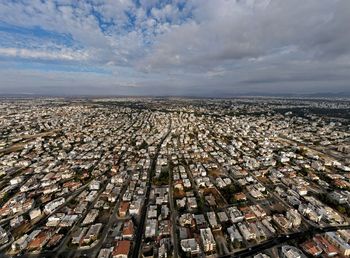 High angle view of city buildings against sky