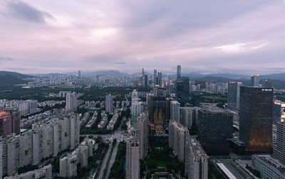 High angle view of modern buildings in city against sky