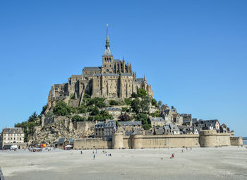 View of historic building against clear blue sky