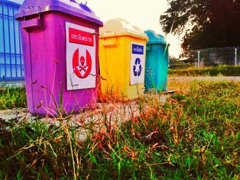 Multi colored sign on grass