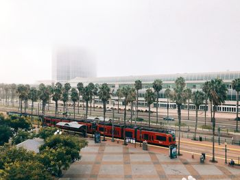 Train against sky in city