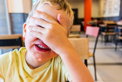 Close-up portrait of boy on table