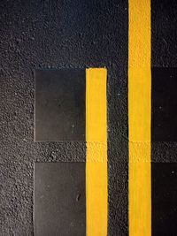 High angle view of yellow lines on road