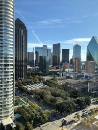 Modern buildings in city against sky