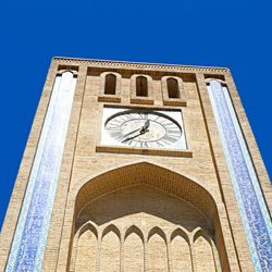 Low angle view of building against blue sky