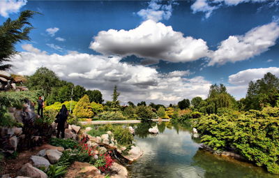 Scenic view of river in forest against sky