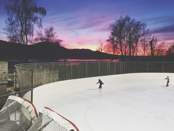 Silhouette of people at sunset