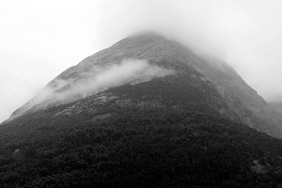 Scenic view of mountains in foggy weather