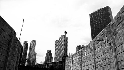 Low angle view of buildings against sky in city