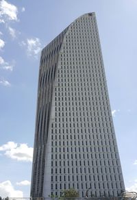 Low angle view of skyscraper against sky