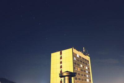 Low angle view of building against sky at night