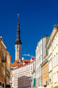 Low angle view of buildings against blue sky