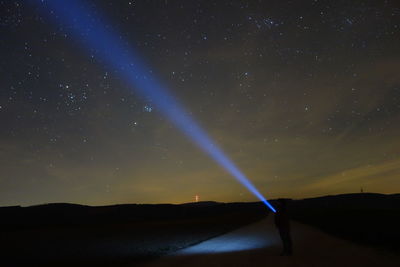 Scenic view of star field against sky at night