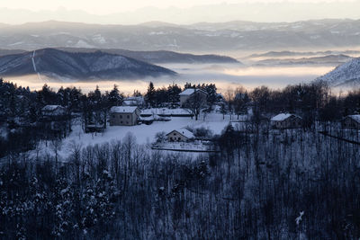 Scenic view of snowcapped mountains against sky during winter