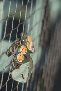 Close-up of chain hanging on fence