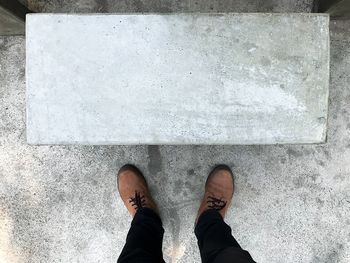 Low section of man standing on floor