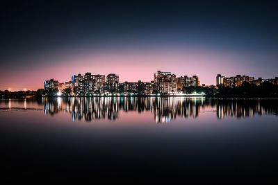 Reflection of buildings in city at night