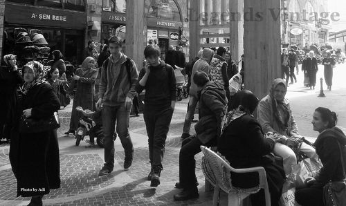 People walking on road in city