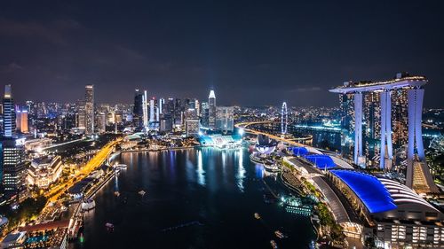 High angle view of illuminated city buildings at night