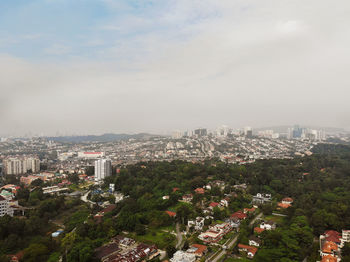 High angle view of buildings in city against sky