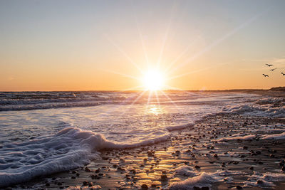 Scenic view of sea against sky during sunset