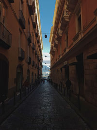 Street amidst residential buildings