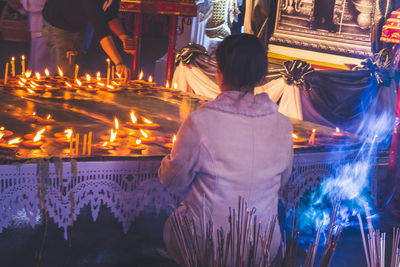 Rear view of woman in temple