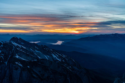 Scenic view of mountains against sky during sunset