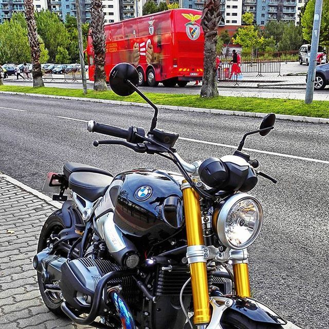 transportation, land vehicle, mode of transport, car, street, bicycle, road, stationary, city, parked, motorcycle, parking, traffic, building exterior, city street, motor scooter, day, city life, travel, outdoors