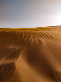 Scenic view of desert against clear sky