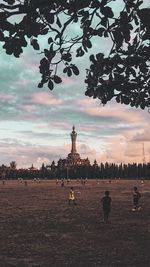 Silhouette of church against cloudy sky