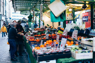 People at market stall