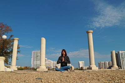 Young woman doing yoga outdoors