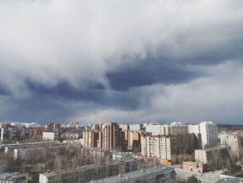 Buildings in city against sky