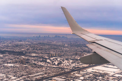 A plane ride to toronto and the cityscape in the distancr