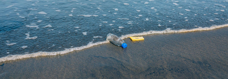 High angle view of yellow umbrella on beach