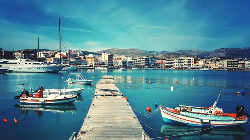 Boats moored at harbor