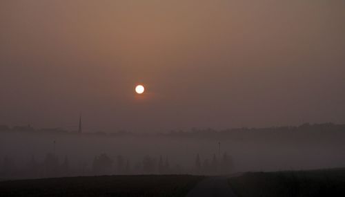 Scenic view of landscape at sunset